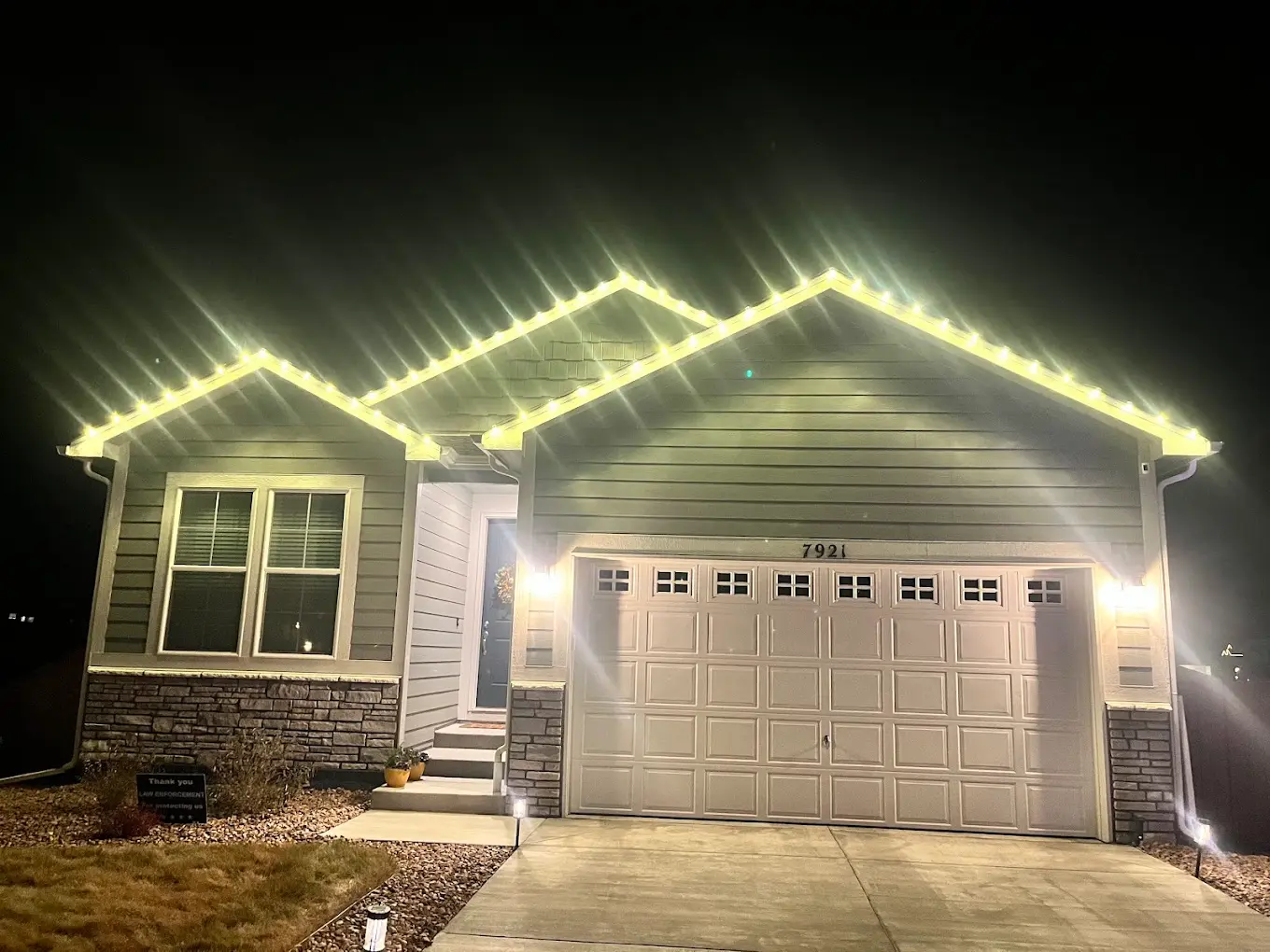 Warm white Christmas lights design example - elegant LED roofline lighting on single-family home, professional holiday display with clean modern aesthetic